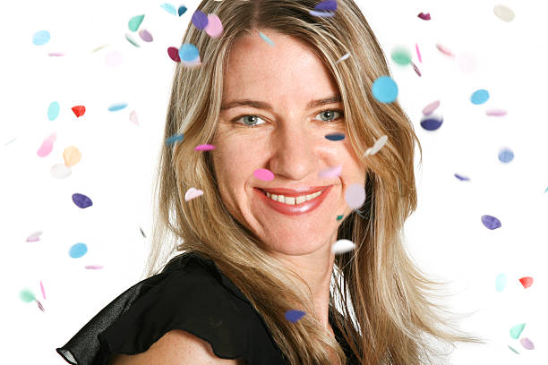 istock Woman celetratinng with falling confetti on white background 183772603