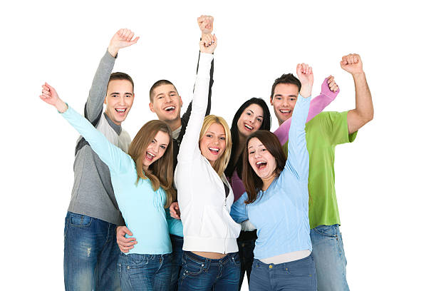 istock Group of young people with hands raised against white background 183773053