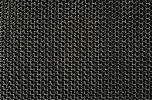  Heavy duty,heavily textured  man made webbing fabric used for making backpacks. Macro full frame background texture.