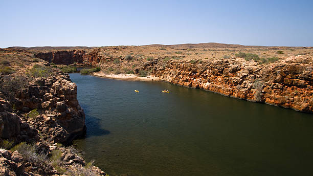 Yardie Creek Gorge Kayakers Yardie Creek Gorge is part of Cape Range National Park. Cape Range National Park borders the waters of the famous Ningaloo Reef in central Western Australia. barron gorge national park stock pictures, royalty-free photos & images
