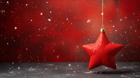 Red Christmas Star Ornament Hanging on Starry Backdrop