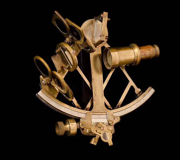 old brass sextant. isolated on black