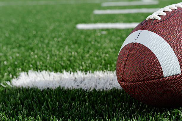 American Football Football on artificial grass american football field photos stock pictures, royalty-free photos & images