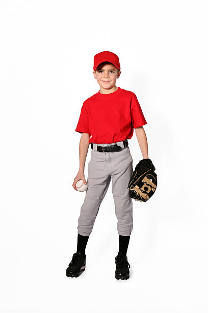 Baseball Player_Little League young little league baseball player isolated on white baseball uniform photos stock pictures, royalty-free photos & images