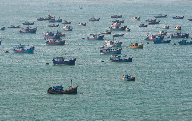 fishing boats in the sea stock photo