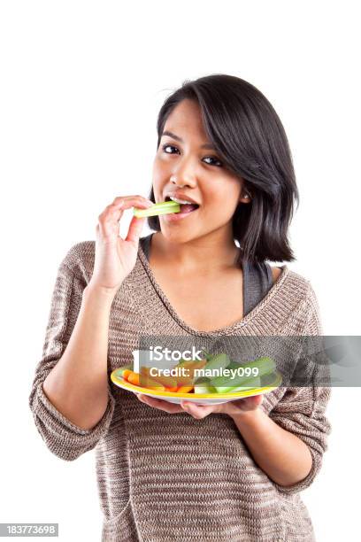 Teenage Girl Eating Vegetables Stock Photo - Download Image Now - Adult, Asian and Indian Ethnicities, Beautiful People