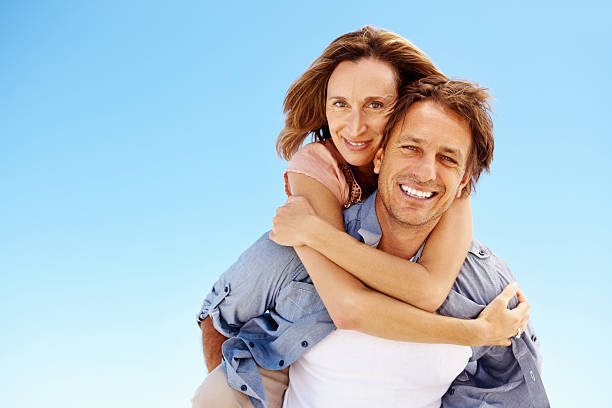 istock Mature couple enjoying piggyback ride 183773763