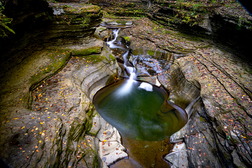 Amazing in nature, beautiful waterfall at colorful autumn forest in fall season