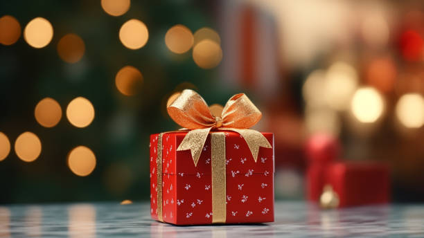 istock Festive Red Gift Box with Golden Bow and Bokeh 1837742472