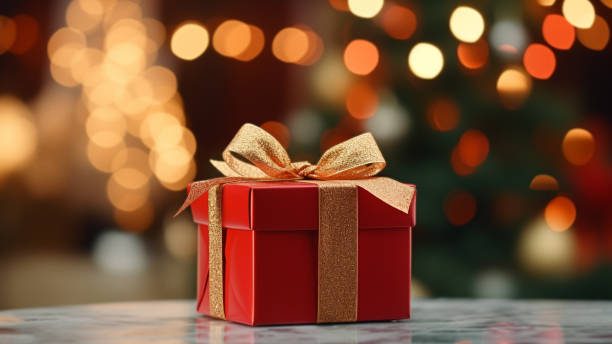 Festive Red Gift Box with Golden Bow and Bokeh