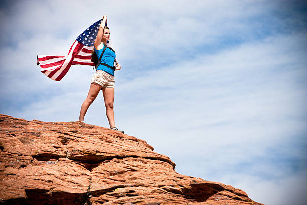 istock Girl Hiker Waving Flag 183774646