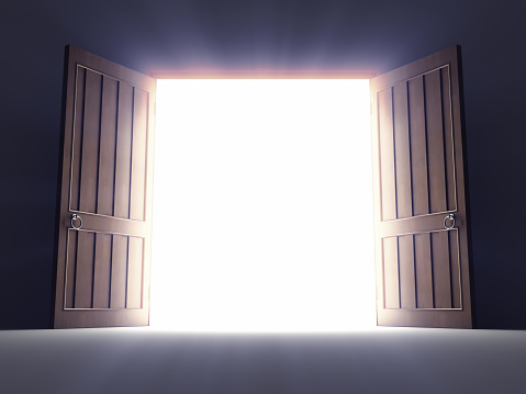 Open old doors with light rays.