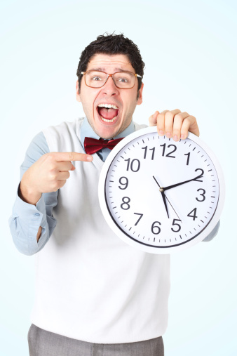 Funny businessman pointing with his finger on big clock ove light blue coloured backgroundYOU ARE WELCOME TO VISIT SOME OF MY MANAGED LIGHTBOXES