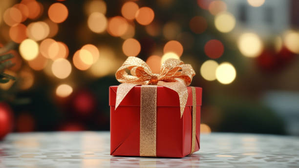 istock Festive Red Gift Box with Golden Bow and Bokeh 1837751816