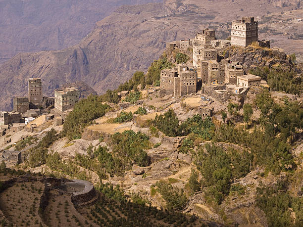 Village with terraces "Yemen coffee and Kaat fields terraces, with traditional house and water reservoir.  Countryside in winter time, View  from the walking path  on AJabal Shogruf mountain , Yemen." arabian peninsula stock pictures, royalty-free photos & images