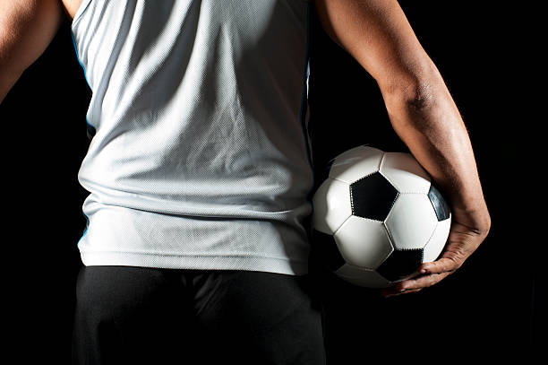 istock Soccer player holding a ball. 183775549