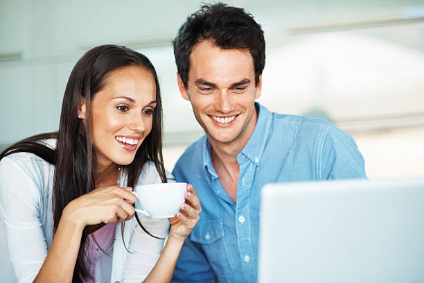 istock Happy couple looking at laptop 183775673