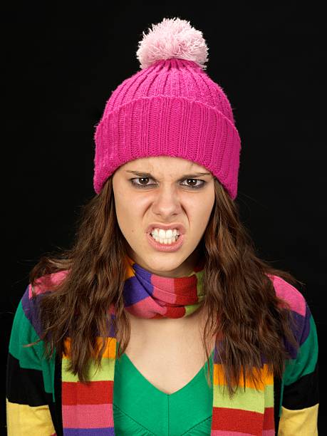 istock angry girl with colored cap 183776346