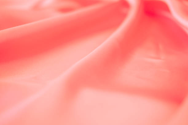 istock Stylish bright orange fabric stripes, blurred background 1837763563