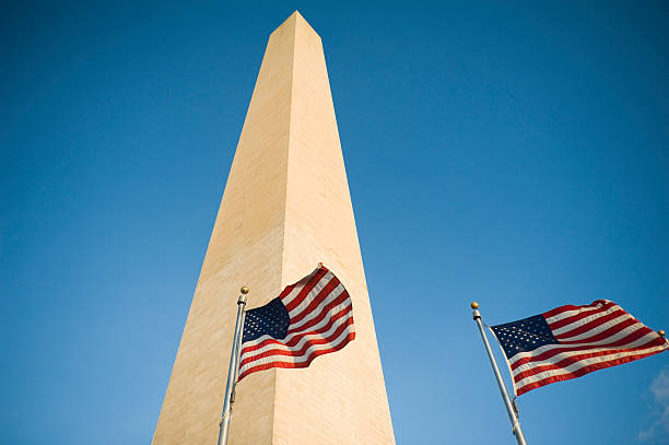 istock american flag near the washington monument at sunrise 183776708