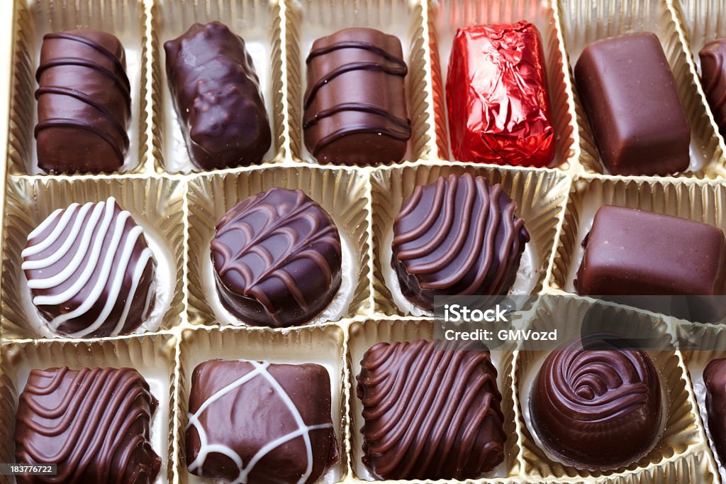 Box of Chocolates Chocolate pralines. Short depth-of-field Box - Container Stock Photo