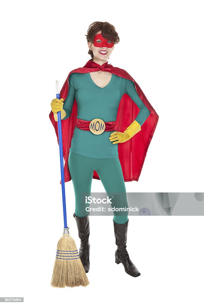 Superhero Mom Smiling With Broom An isolated image of a superhero mom smiling and holding a broom. Superhero Stock Photo