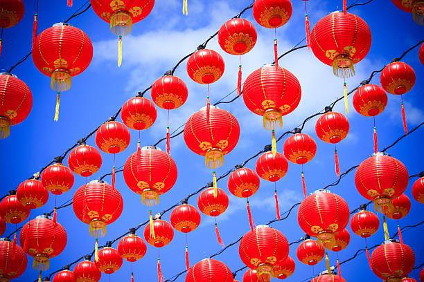 китайский новый год светильникам против голубого неба. - celebration event abundance lantern traditional festival стоковые фото и изображения