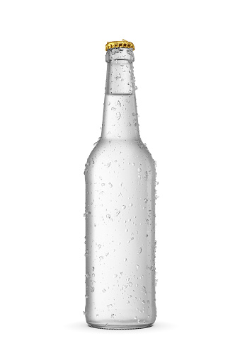 Water in long neck glass bottle with water droplets and ice crystals isolated on a white background.