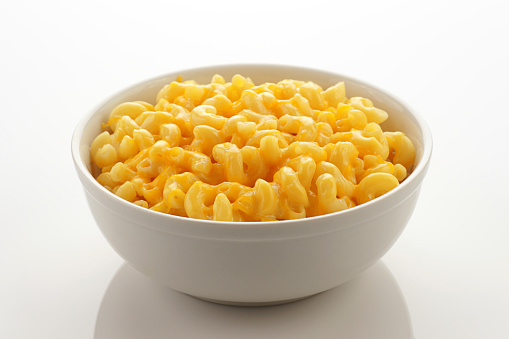 Simply a bowl of macaroni and cheese on clean white.