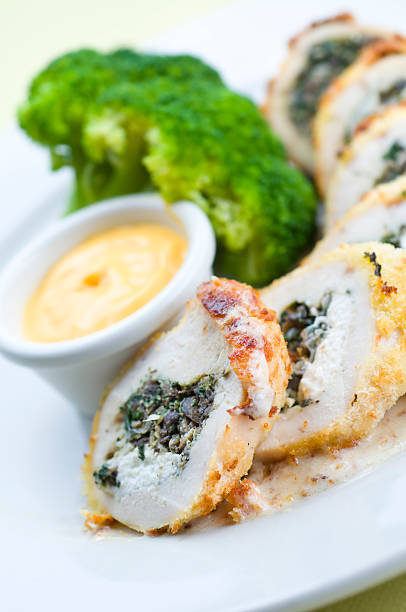 chicken breast stuffed with spinach and mushroom stuffing, complimented with goat cheese on a bed of bacon garlic sauce.