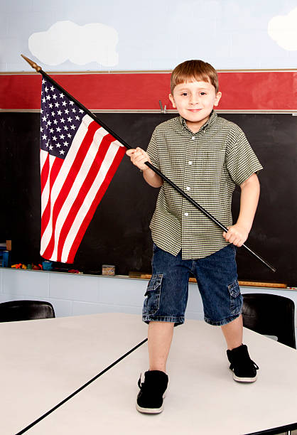 istock Young Boy with American Flag on a Table 183778565