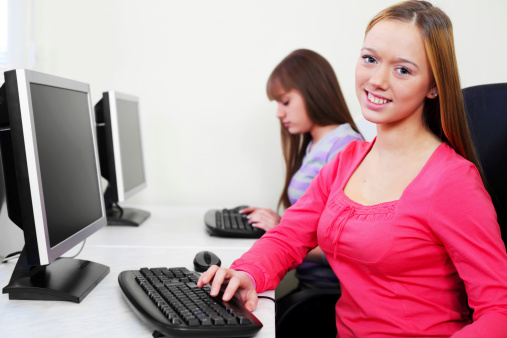 Student Using Computer Jift Young Students Using Computers In The Classroom Stock Photo - Download ...