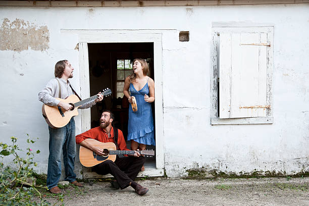 Musicians playing in doorway of run-down building