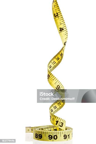 Tape Measure Spirals Upwards Stock Photo - Download Image Now - Color Image, Concepts, Concepts & Topics