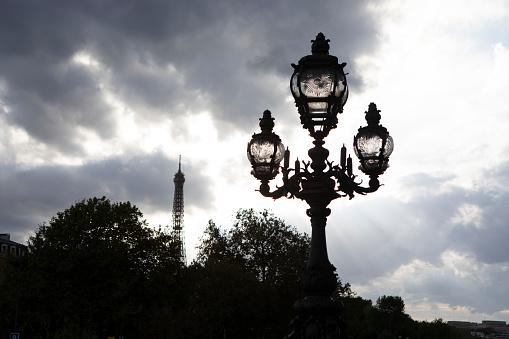 Lamp post on Pont Alexandre III against a dramatic sky