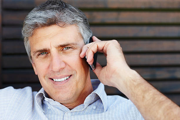 istock Mature man talking on cell phone 183779796
