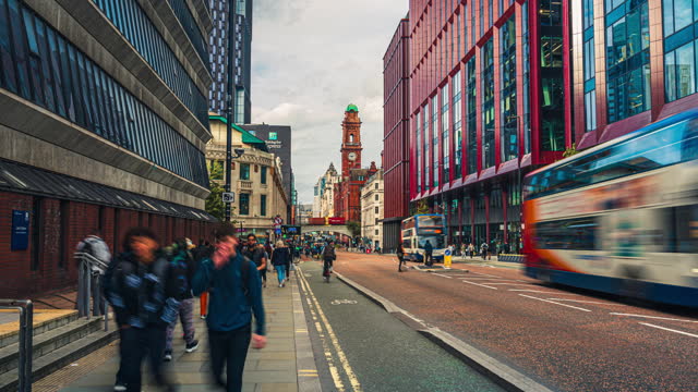 Time lapse of Crowded Commuter People and Tourist walking and traveling around Manchester Oxford road, Kimpton Clocktower