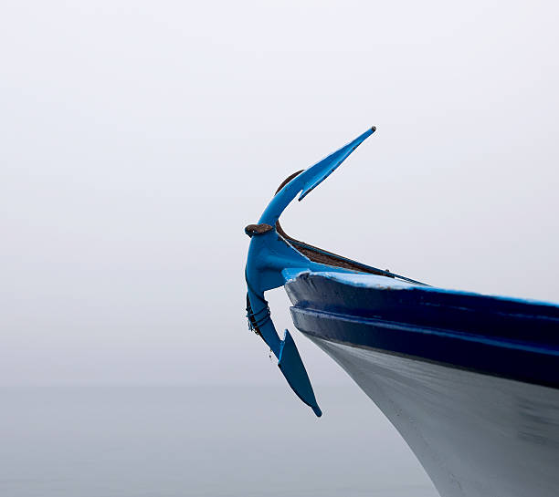 Close up of an anchor on bow of boat