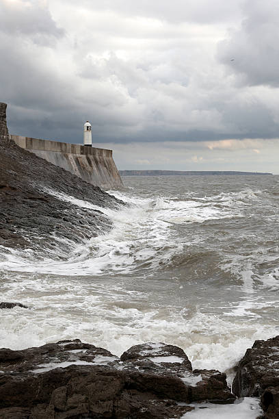 istock Porthcawl lighthouse waves crashing near sunset 183780114