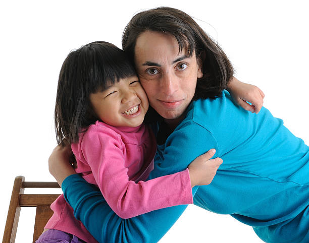 istock Adoptive Family: Mother and Daughter Hugging 183780298