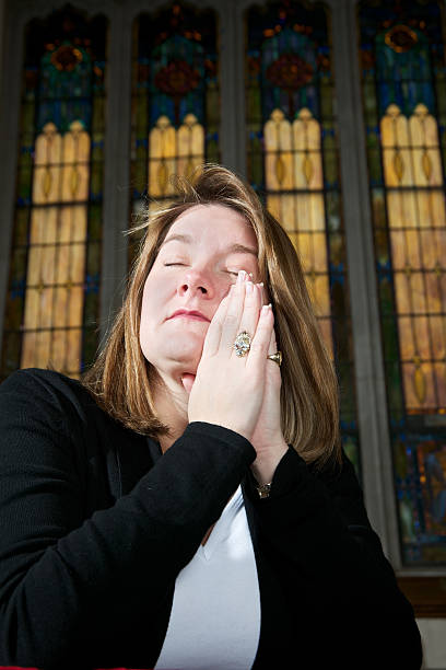 istock Eyes Closed on Woman Praying 183780337