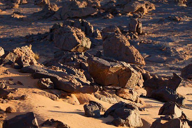 istock Evening falling over rocks in Libyan Sahara desert 183780509