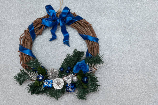 istock Homemade christmas wreath on a silver glitter background 1837805488