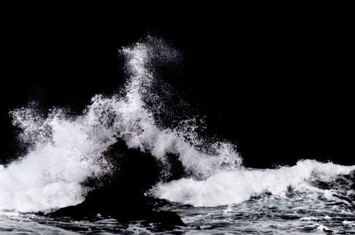 A splash of whitewater on a dark background