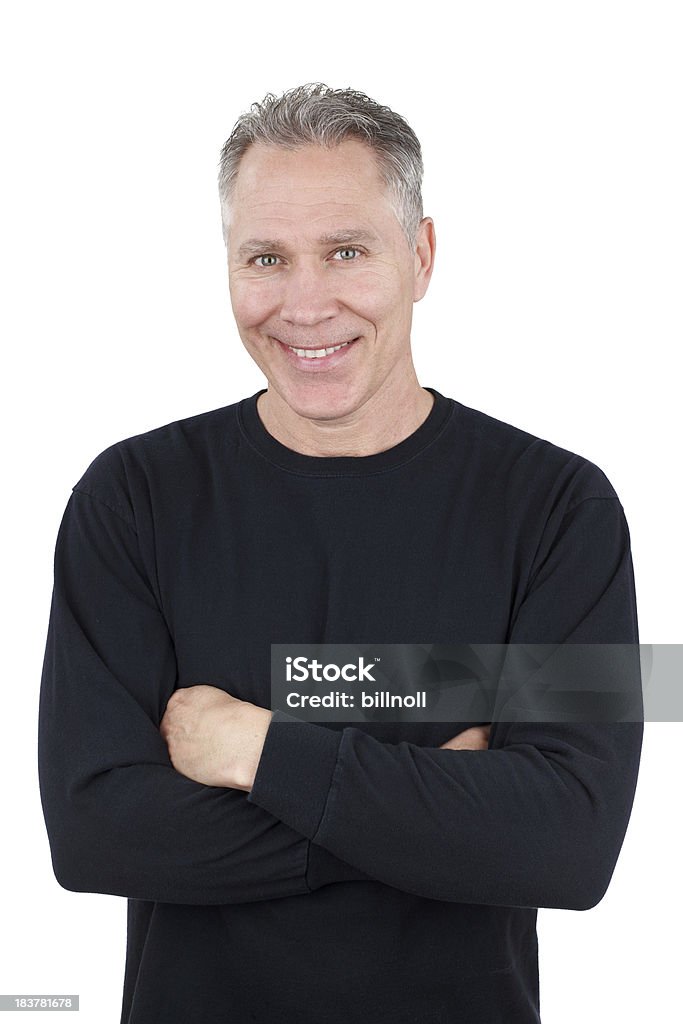 Улыбающегося Средний возраст человек с черный рубашка с длинными рукавами - Стоковые фото Чёрный цвет роялти-фри
