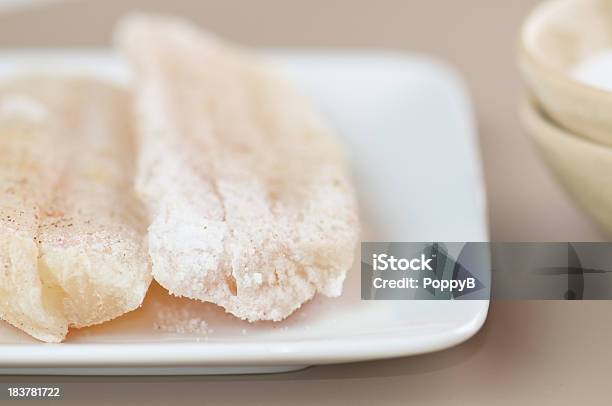 Salted Cod Fillets On White Plate Stock Photo - Download Image Now - Close-up, Cod, Dried Fish