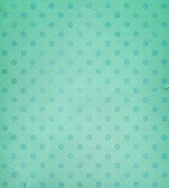 istock torn green paper with faded dots 183782141