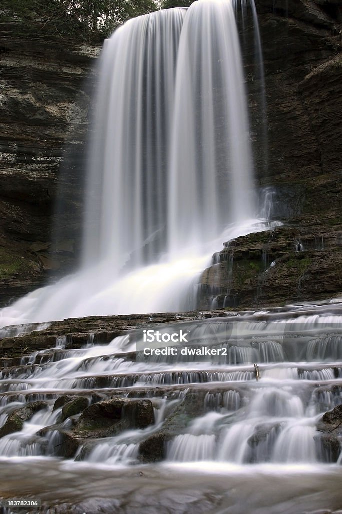 Secluded Waterfall A high waterfall with stair-step like cascades downstream.See more of my waterfall and stream pictures Beauty In Nature Stock Photo