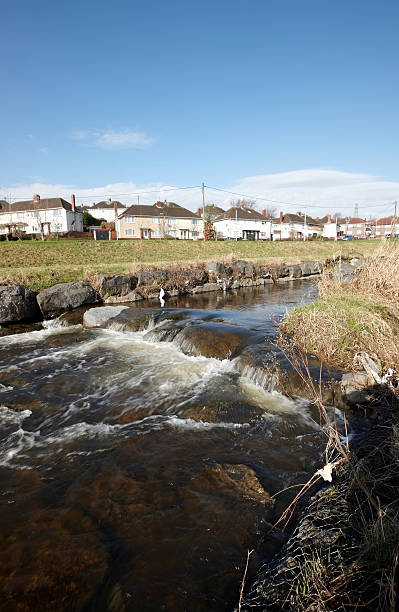 istock Morning sunlight on welsh town municipal housing stream foreground 183782334