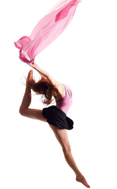 istock Dancer jump on white background with pink fabric 183782588